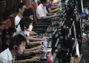 Customers use computers at an internet cafe in Hefei