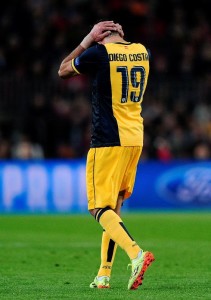 Atletico Madrid's Brazilian forward Diego da Silva Costa leaves the pitch after being injured during the UEFA Champions League quarterfinal first leg football match FC Barcelona vs Club Atletico de Madrid at the Camp Nou stadium in Barcelona on April 1, 2014.   AFP PHOTO/ JOSEP LAGO