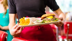 Waitress serving in American diner or restaurant