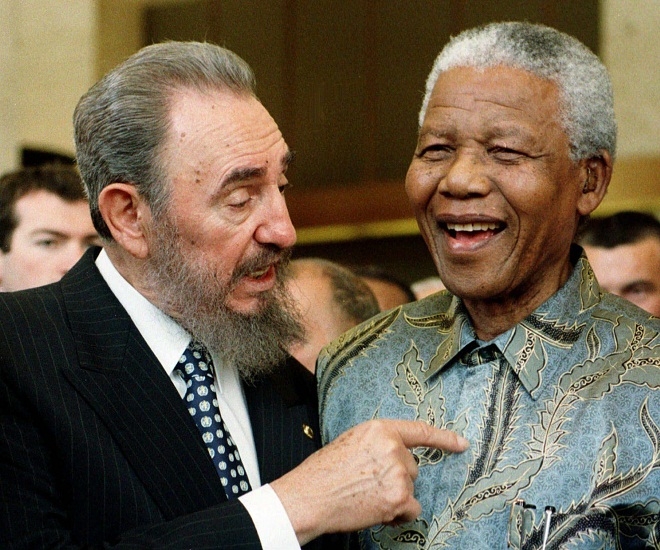 epa03978386 (FILE) A file picture dated 19 May 1998 shows South African Nobel Peace Prize winner and iconic political prisoner Nelson Mandela (R) with Cuban President Fidel Castro at a ceremony marking the 50th anniversary of the GATT Agreement, during the ministerial conference of the World Trade Organisation (WTO) in Geneva, Switzerland. According to media reports Nelson Mandela has died aged 95, in Johannesburg, South Africa, on 05 December 2013. A former lawyer, Mandela was the first black President of South Africa voted into power after the countries first free and fair democratic elections that witnessed  the end of the  Apartheid system in 1994.  Mandela was founding member of the ANC (African National Congress) and anti-apartheid activist who served 27 years in prison, spending many of these years on Robben Island. In South Africa, Mandela is often known as uTata Madiba, an honorary title adopted by elders of Mandela's clan. Mandela won the Nobel Peace Prize in 1993.  EPA/PATRICK AVIOLAT