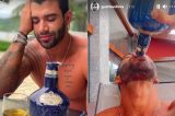 Gusttavo Lima seca garrafa de uísque de R$ 1,1 mil em tarde de bebedeira